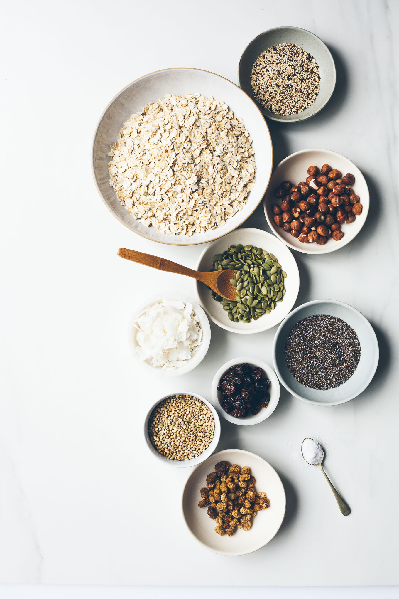 Overhead shot of bowls of ingredients for making granola