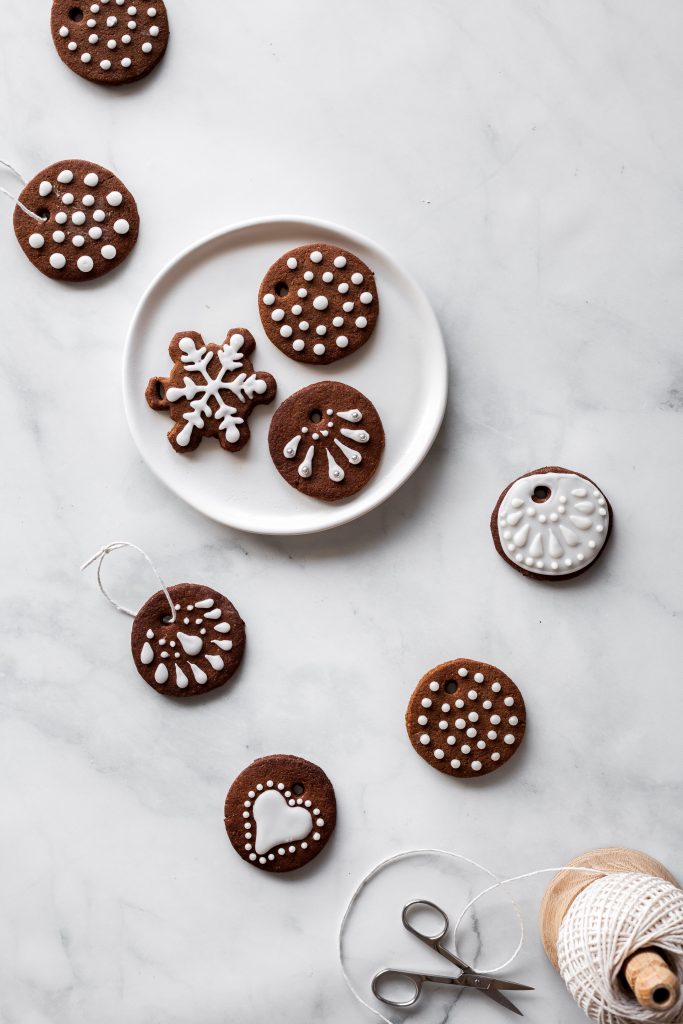 overhead of Edible Gingerbread Cookie Ornaments on a plate.
