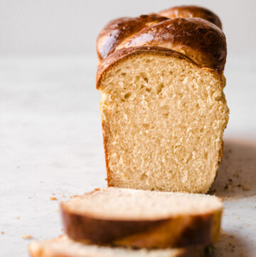 Head on image of brioche bread with two slices taken off.