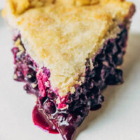 Close up of vegan blueberry pie on a plate.