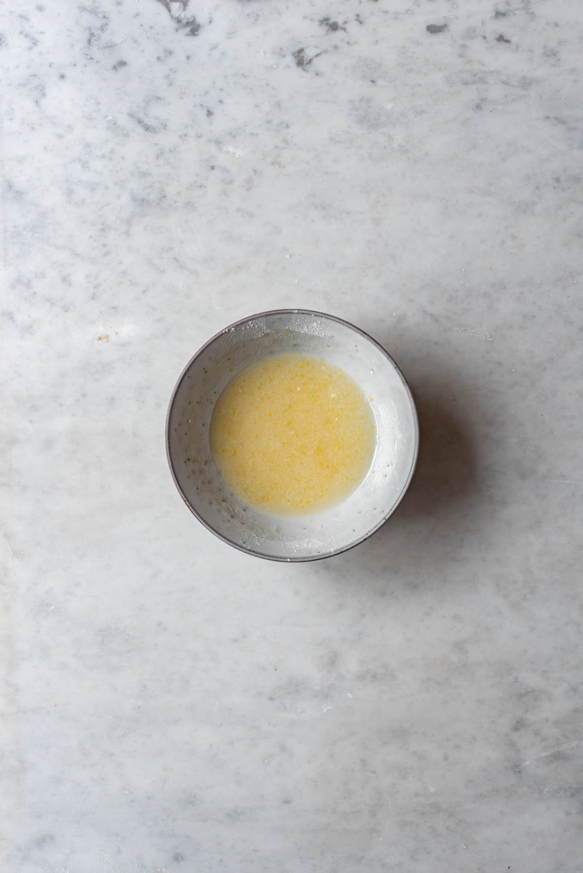 A small bowl of lemon juice.