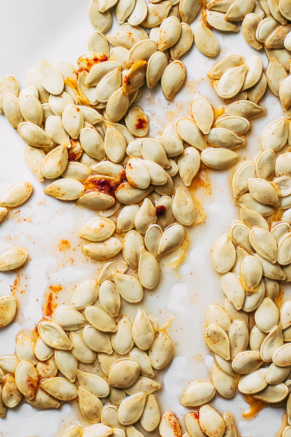 Raw pumpkin seeds tossed with oil and spices.