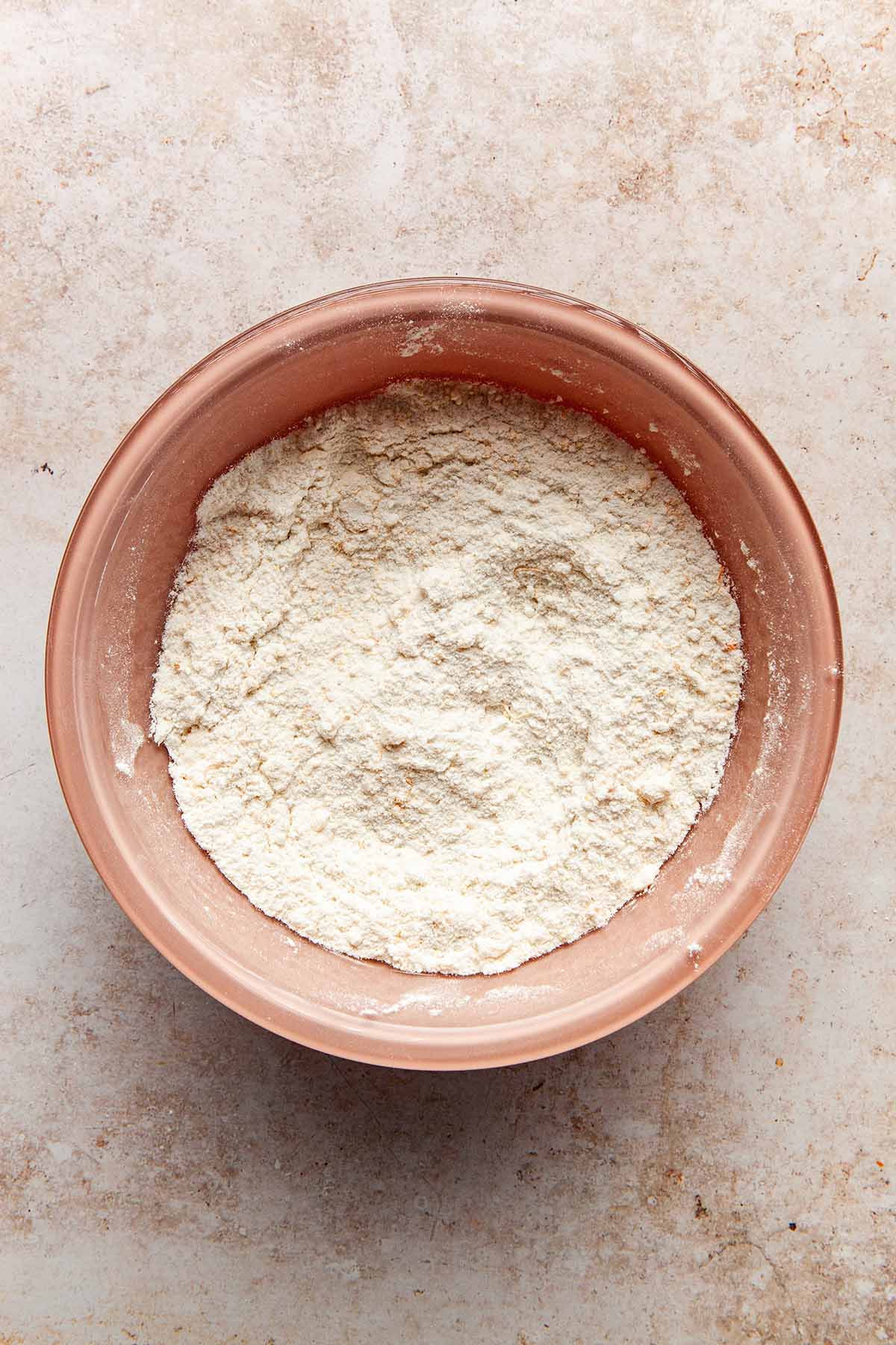 A bowl of dry cake ingredients.