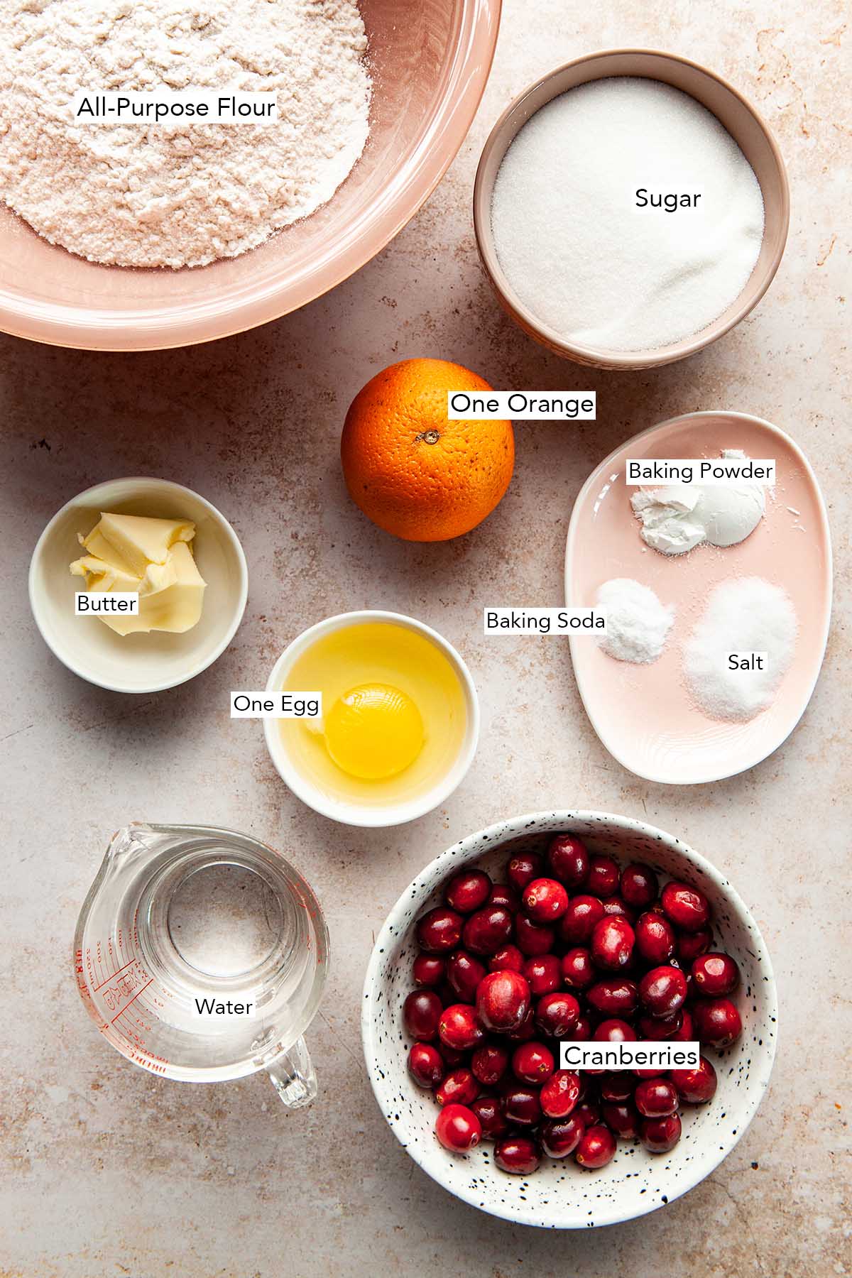 Ingredients to make a cranberry orange loaf.