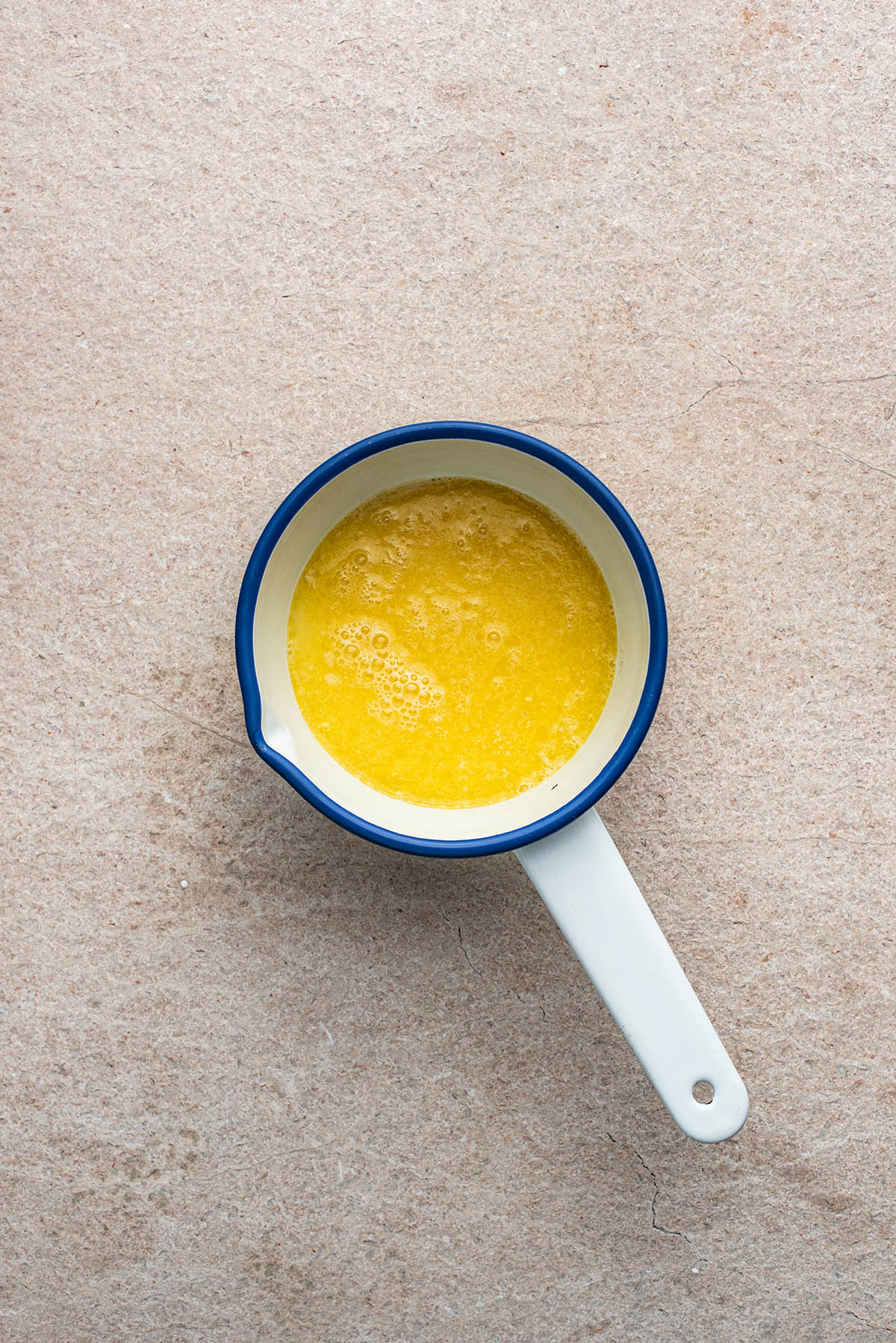 Melted butter and milk in a small pan.