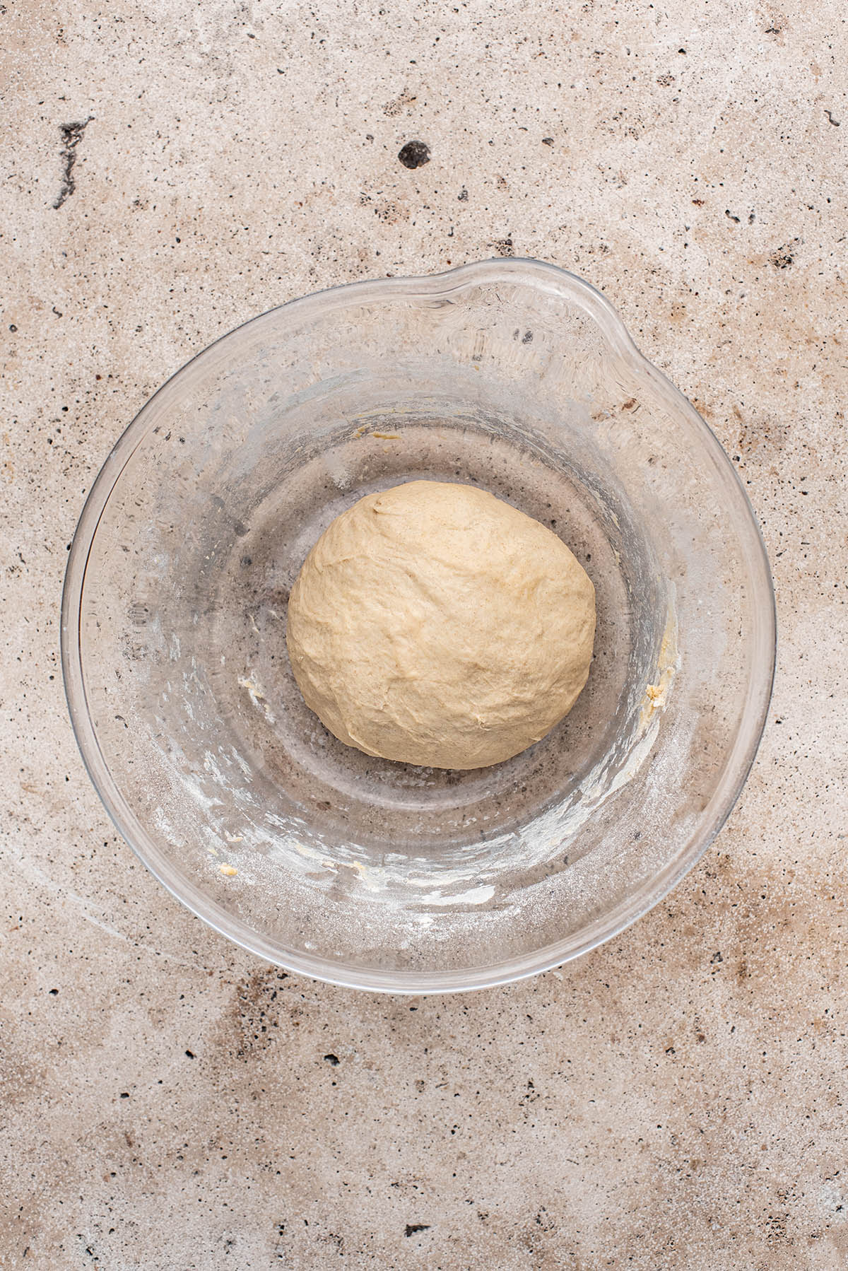 Kneaded tortilla dough in a large bowl.
