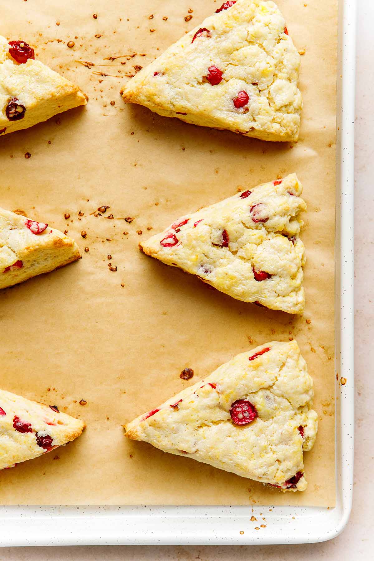 A pan of baked orange cranberry scones.
