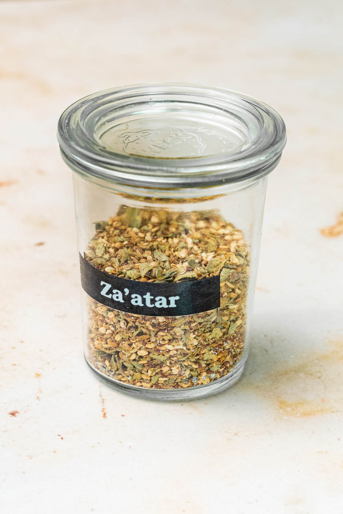 Jar of za'atar with a label.