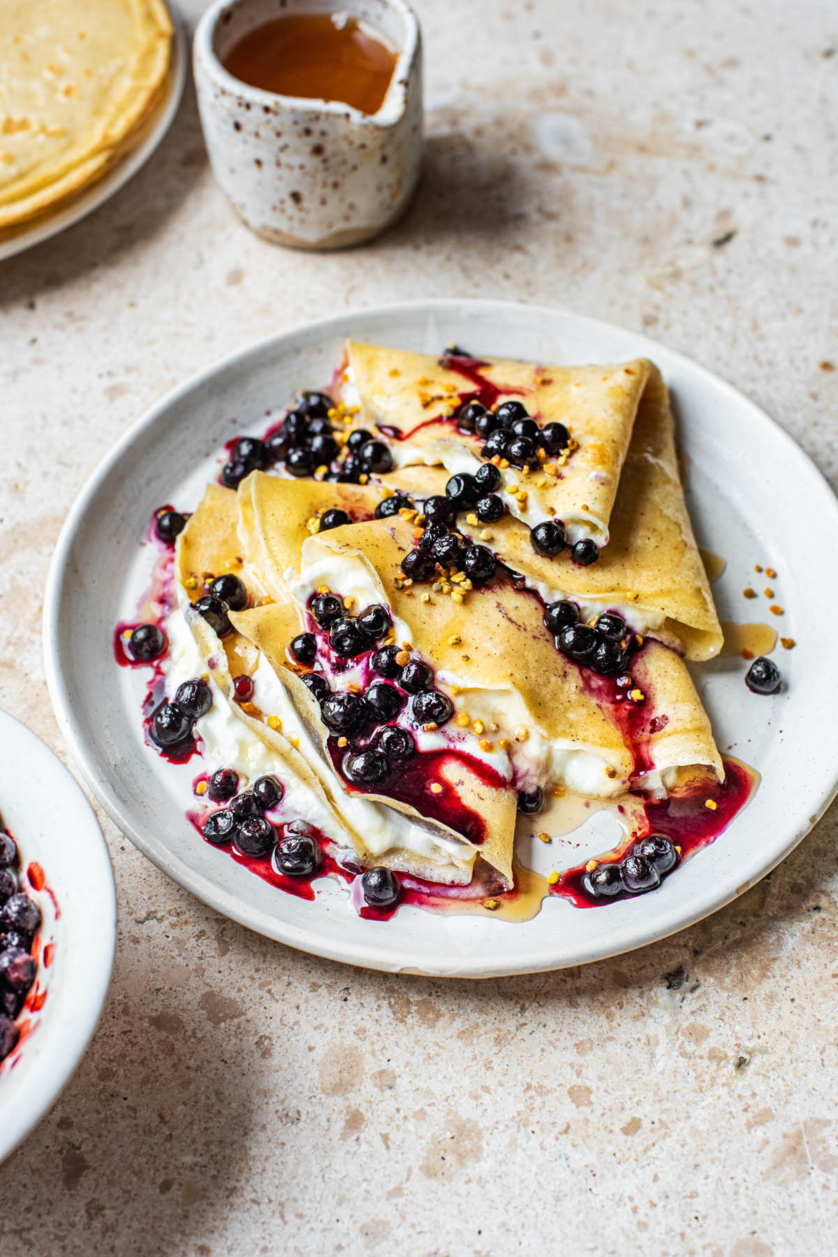 Folded crepes with yogurt and berries.