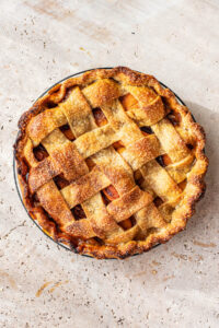 Top down view of apricot pie with a lattice crust.