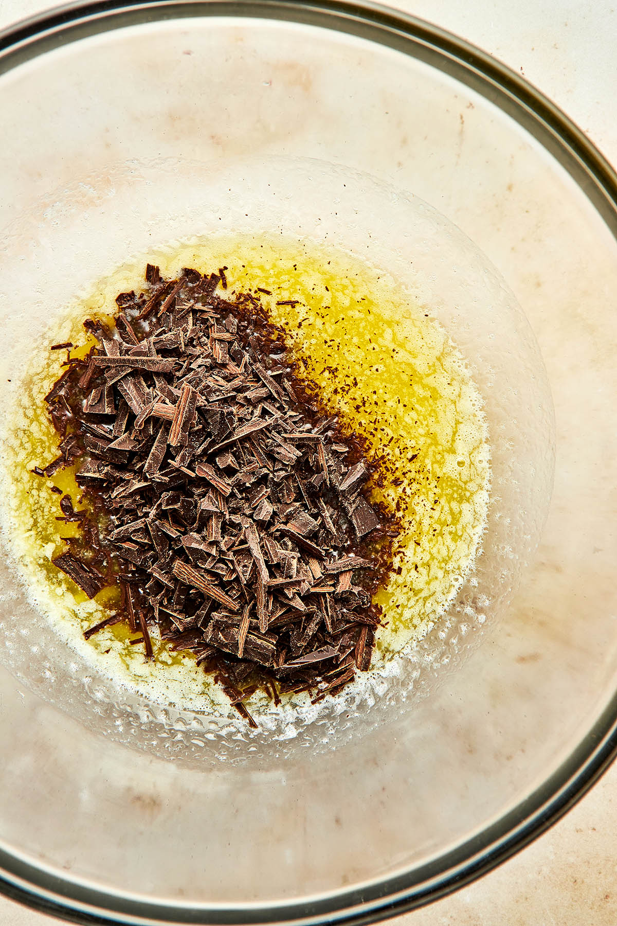 Finely chopped chocolate in a bowl of melted butter.
