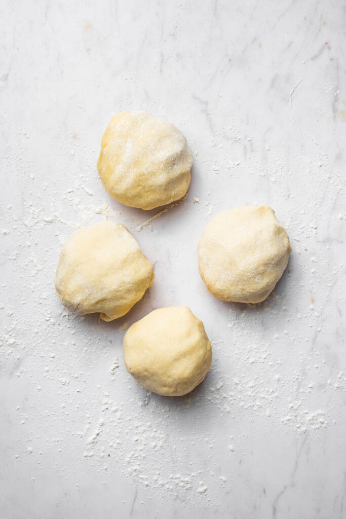 Four balls of dough.