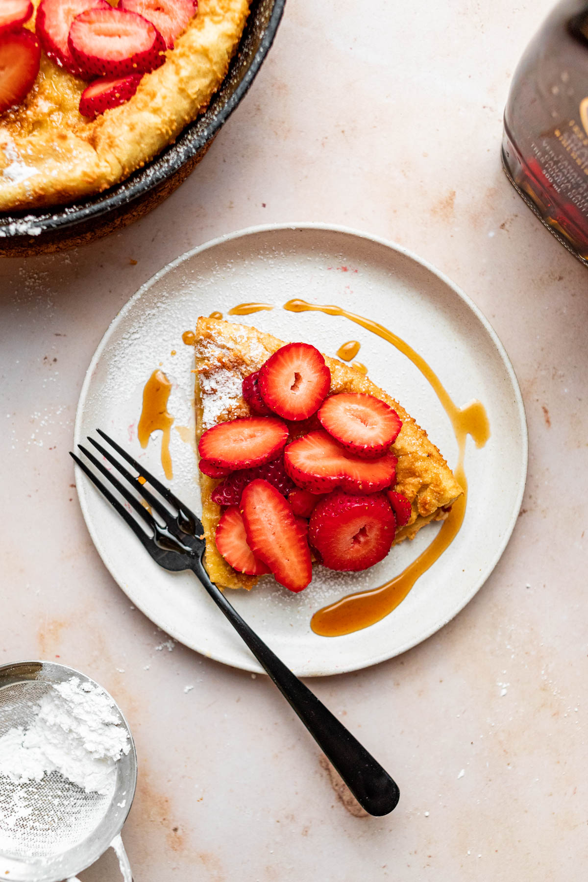 A slice of gluten-free Dutch Baby on a plate.