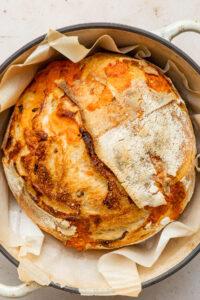 Close up overhead image of a loaf of jalapeño cheddar sourdough bread.