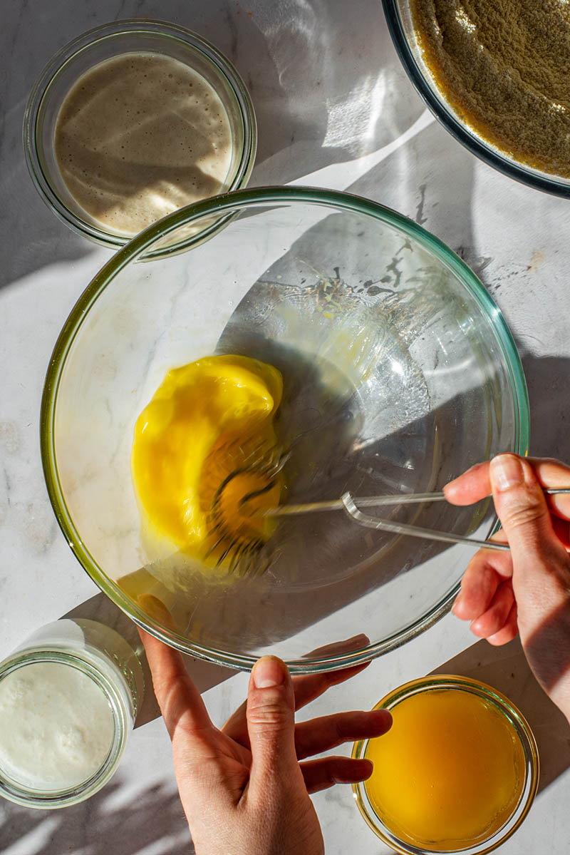 Whisking egg in a bowl.