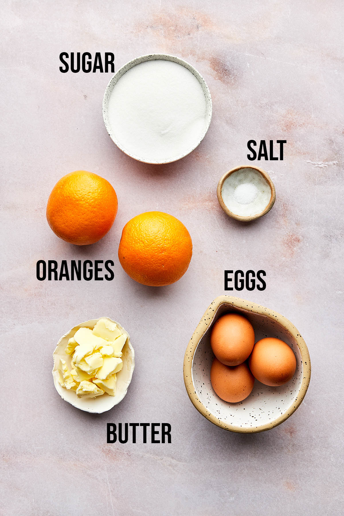 Ingredients to make this recipe laid out on a pink marble surface.